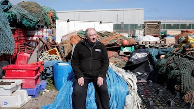 Former fisherman Steve Horsley now repairs nets at the harbour but his work has depleted over the last six months due to Covid-19. Stuart Boulton for The National