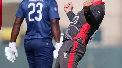 Rohan Mustafa celebrating after taking the wicket of USA's Steven Taylor during a World Cup League 2 match . Pawan Singh / The National