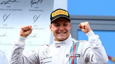 Valtteri Bottas of Williams celebrates his third-place finish at the Austrian Grand Prix on Sunday in Spielberg, Austria. Mark Thompson / Getty Images / June 22, 2014
