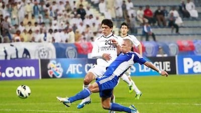 Al Nasr's Takayuki Morimoto, below, scored in the 30th minute against Lokomotiv Tashkent on Saturday night in Dubai. Jake Badger for The National