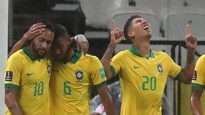 Roberto Firmino (R) celebrates next to teammates Neymar and Renan Lodi after scoring against Bolivia. AFP