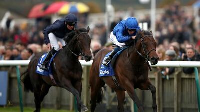 Pinatubo, ridden by William Buick, right, wins The Darley Dewhurst Stakes during Day Two of the Dubai Future Champions Festival at Newmarket Racecourse. PA Wire