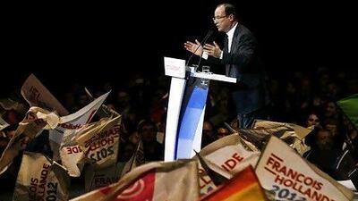 Francois Hollande says Nicolas Sarkozy is lying about Muslims being told to vote.