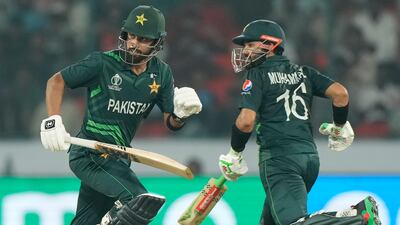 Pakistan's Abdullah Shafique, left, and his batting partner Mohammad Rizwan run between the wickets to score during the ICC Cricket World Cup match between Pakistan and Sri Lanka in Hyderabad, India, Tuesday, Oct. 10, 2023. (AP Photo/ Mahesh Kumar A. )
