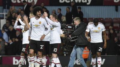 Manchester United’s Wayne Rooney and Marouane Fellaini celebrate winning after the match. Reuters / Toby Melville
