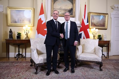British Prime Minister Keir Starmer welcomes the new Prime Minister of Canada, Mark Carney, at 10 Downing Street in London.