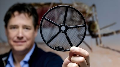 Dr. Tim Mohlmann shows a disc with mesh of the so-called EaveTube system in Wageningen, The Netherlands eariler this year. The invention by the company In2Care, a special ventilation pipe for homes, containing a mosquito net impregnated with insecticides, reduces the risk of malaria. EPA-EFE/ROBIN VAN LONKHUIJSEN