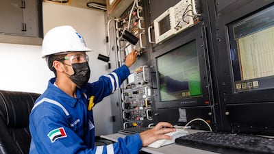 An Adnoc Drilling wireline field engineer analyses geophysical data as part of the company’s start-to-finish drilling services offering, which is unique across national drilling companies in the region.