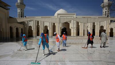Volunteers disinfects a mosque on the first day of Ramadan, in Peshawar, Pakistan. AP Photo