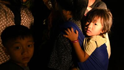 Many women and children were among those who fled. AFP