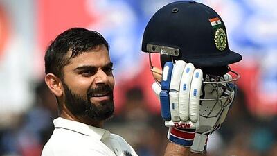 Virat Kohli celebrates after scoring a double century. Punit Paranjpe / AFP