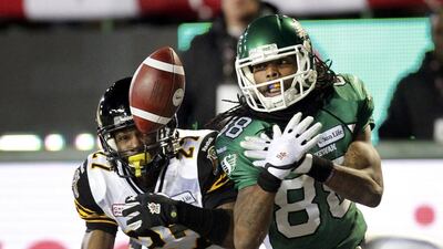 The Hamilton Tiger-Cats Delvin Breaux breaks up a pass to the Saskatchewan Roughriders Taj Smith. David Stobbe / Reuters