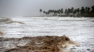 Strong waves and wind pound a beach during Cyclone Mekunu in Salalah, Oman, May 26, 2018. Cyclone Mekunu blew into the Arabian Peninsula early Saturday, drenching arid Oman and Yemen with rain, cutting off power lines, officials said. Kamran Jebreili / AP Photo