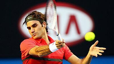 Roger Federer plays a forehand in his first-round match against Alexander Kudryavtsev.