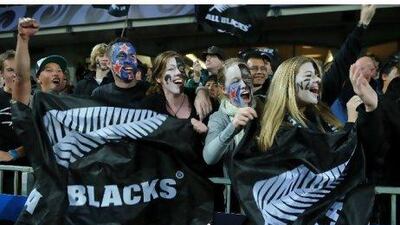 New Zealand supporters cheer their team during a Rugby World Cup match against Tonga in Auckland last month. They will be hoping for a win over Australia in the semi-final, which would take the All Blacks to within one match of winning a title that has eluded them so far.