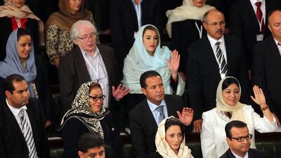 Members of the Tunisian House of People's representatives take an oath during the inaugural session, in Tunis, last week. Mohamed Messara / EPA