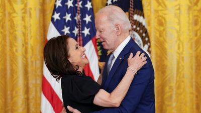 2021 National Medal of Arts recipient actress Julia Louis-Dreyfus hugs US President Joe Biden as he presents her with the medal during a ceremony in the East Room of the White House. Reuters