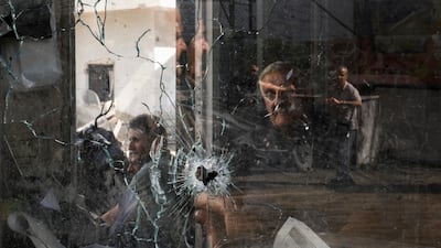 A bullet hole in a shop window after an Israeli military raid in the Jenin refugee camp, West Bank. AP
