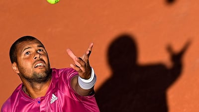 French player Jo-Wilfried Tsonga serves during his win over Japan's Yoshihito Nishioka in their French Open first-round match at Roland Garros in Paris on May 31, 2021. AFP