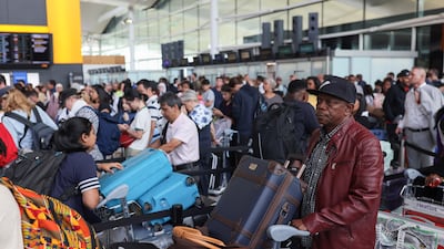 Passengers wait in line at Heathrow Airport near London after air traffic control systems failed. Reuters