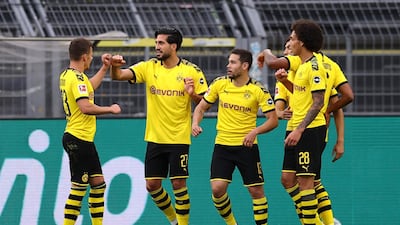 BORUSSIA DORTMUND 1 HERTHA BERLIN 0: Dortmund's Emre Can, second left, celebrates with teammates after scoring the winner against Hertha Berlin at Signal Iduna Park on Saturday, June 6, 2020. AP