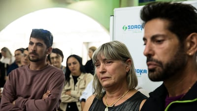 Uri Rawitz, right, and his sister Tali Amano speak of their mother's condition. Getty Images