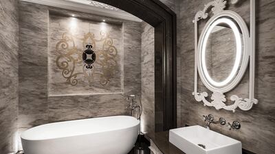 The light on the mirror adds a touch of new to its classic surroundings. Courtesy LuxuryProperty.com