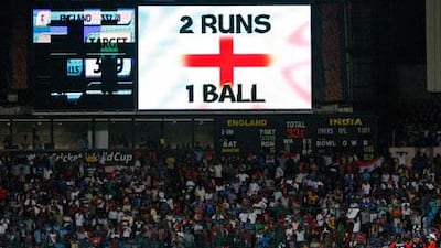 A scoreboard shows the required two balls from one run required for England to win against India.