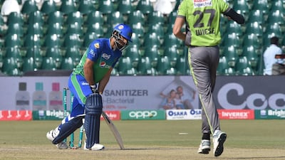 Lahore Qalandars' Shan Masood, right,) celebrates the wicket of David Wiese. AFP