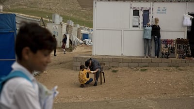 Ahmed with his sister, Manal. He now lives at the Esyan Camp in Iraq with his mother, sister and brother — the only surviving members of his family.