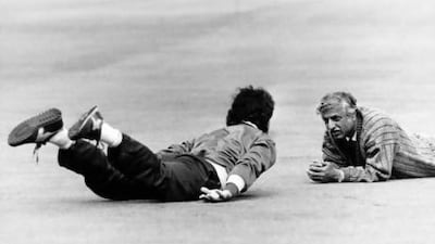Hasseb Ahsan, right, works with Pakistan captain Imran Kan during a training session at Lord's in England during a tour in 1987. PA