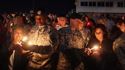 A candlelight vigil is held for those killed and wounded by Major Nidal Malik Hasan.