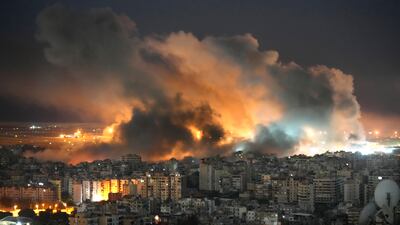 Flames and smoke rise in the aftermath of Israeli air strikes on Dahieh, southern Beirut. AP