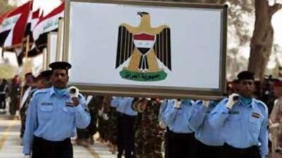 The Iraqi armed forces parade in the streets of the city of Hilla, in Babel province, during a ceremony for the official transfer of security from the US army.