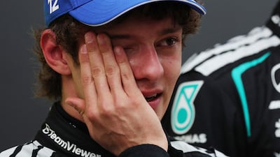 Kimi Antonelli wipes away a tear after winning the Chinese Grand Prix. Reuters