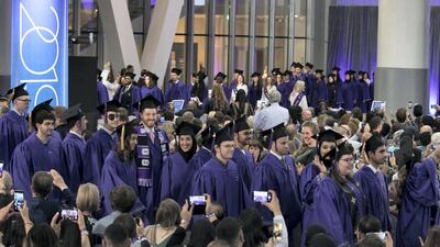 Entrance of graduates of NYU Abu Dhabi. Leslie Pableo for The National