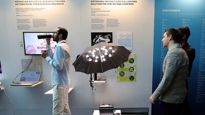 Visitors at the Prototypes for Humanity exhibition held at the Boulevard in the Emirates Towers in Dubai. Pawan Singh / The National