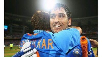 Sachin Tendulkar and MS Dhoni celebrate India's victory in the Cricket World Cup final. A reader applauds team captain MS Dhoni's entrance into the pantheon of cricket history. Matthew Lewis / Getty Images