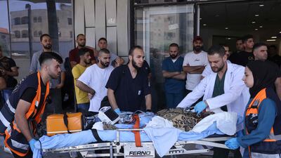 Palestinian medics take an injured person to hospital during the Israeli military operation in Jenin. AFP