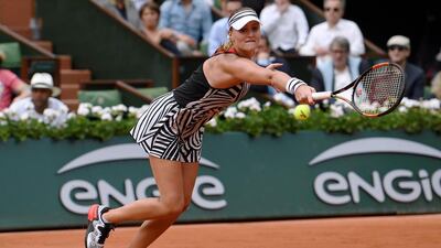 France’s Kristina Mladenovic returns the ball to US player Serena Williams during their women’s third round match at the Roland Garros 2016 French Tennis Open in Paris on May 28, 2016. / AFP / MIGUEL MEDINA