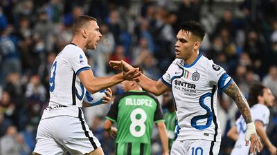 Inter Milan's Edin Dzeko, left, celebrates with teammate Lautaro Martinez, right. AP