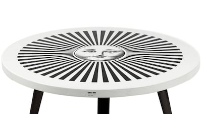 Lacquered table, Dh9,779 Fornasetti at Farfetch