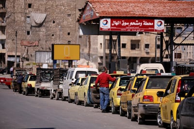 Drivers in Aleppo, Syria, queuing for petrol which has had three price rises in four months. Reuters