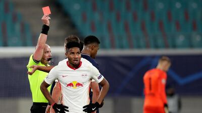 Referee Szymon Marciniak shows a red card to PSG's Presnel Kimpembe. AP