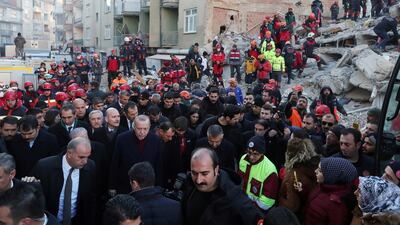 Turkish President Tayyip Erdogan visits a neighborhood hit by an earthquake in Elazig, Turkey. Reuters