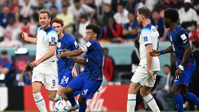 England's Harry Kane fights for the ball with USA's midfielder Tyler Adams during their World Cup match. AFP