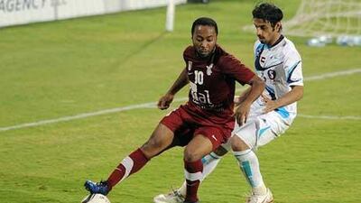 Ismail Matar, the Al Wahda forward, shields the ball while on the attack against Baniyas last night.