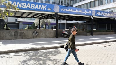 A man walks near a branch of Fransabank in Beirut, Lebanon, on March 8. Reuters