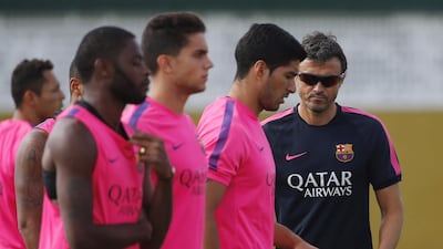 Luis Enrique and Barcelona will win the liga title if they beat Atletico Madrid on Sunday. Emilio Morenatti / AP Photo