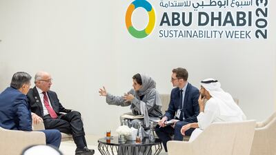 Laurent Fabius (2nd L), president of the constitutional council of France, speaks to guests at Abu Dhabi National Exhibition Centre. Photo: Presidential Court